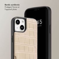 Selencia Coque de télephone Nova Croco avec cordon et porte-cartes Apple iPhone 13 - Beige